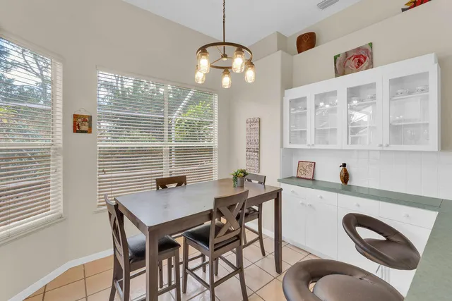 a dining room with furniture and window