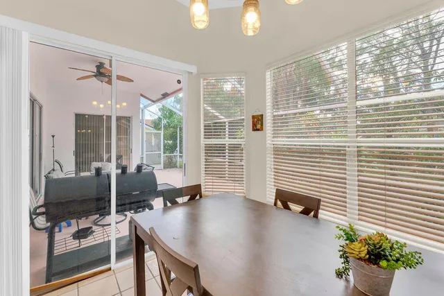 a view of a livingroom with furniture and a window