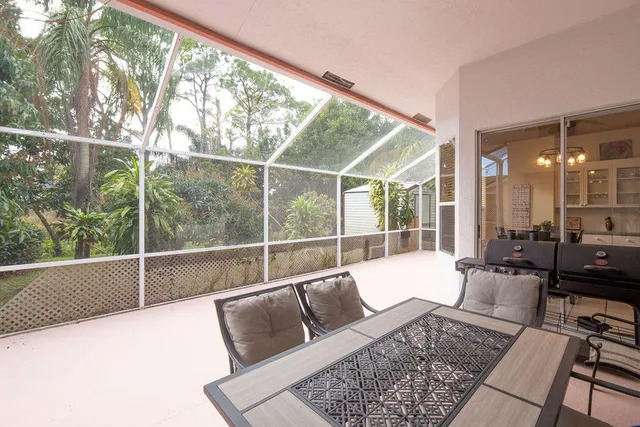 a view of a hall with dining area and glass door