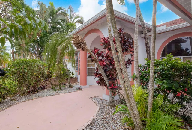 a view of path along with house and trees