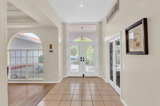 a view of an entryway with wooden floor and door