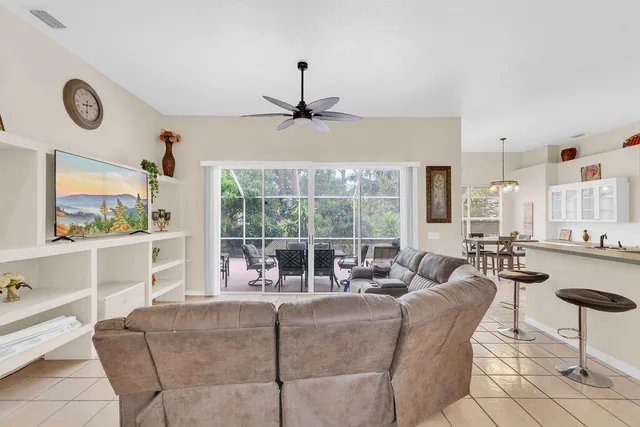 a living room with fireplace furniture and a window