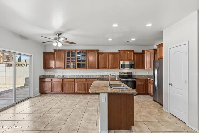 a kitchen with a sink cabinets and window