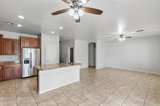 a kitchen with a sink appliances and cabinets