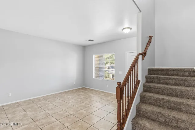 a living room with stainless steel appliances kitchen island granite countertop furniture and a kitchen view