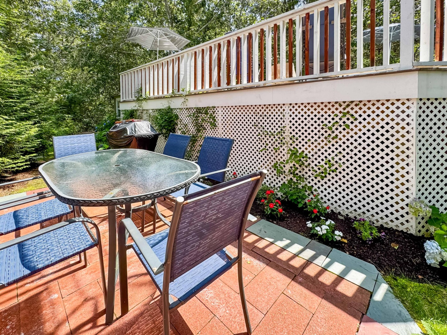 58 Rd To The Plaines Edgartown, MA 02539 - Photo 5 of 40 a backyard of a house with a swing table and chairs