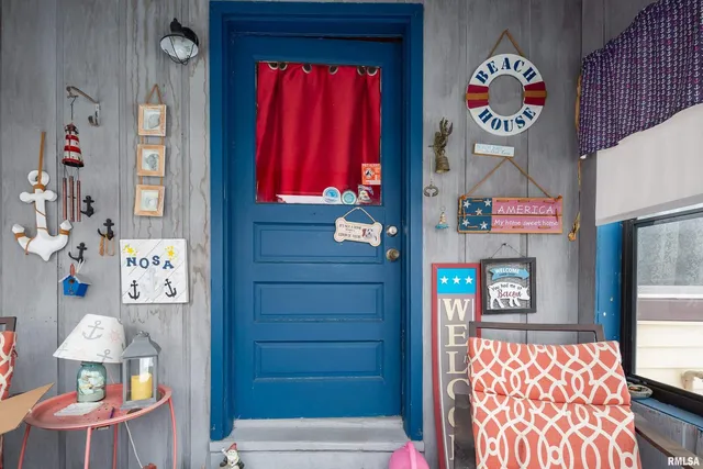 a bathroom with a sink a toilet and shower curtain