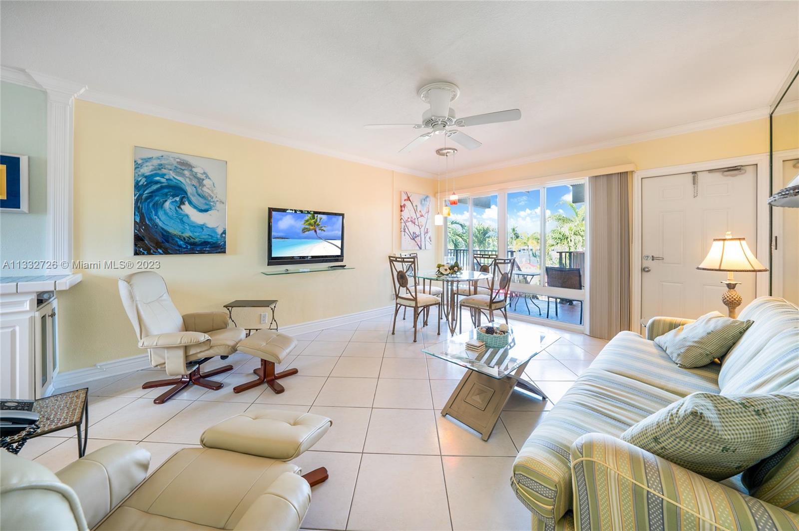 555 North Riverside Drive, Unit 15 Pompano Beach, FL 33062 - Photo 11 of 18 a living room with furniture and a large window