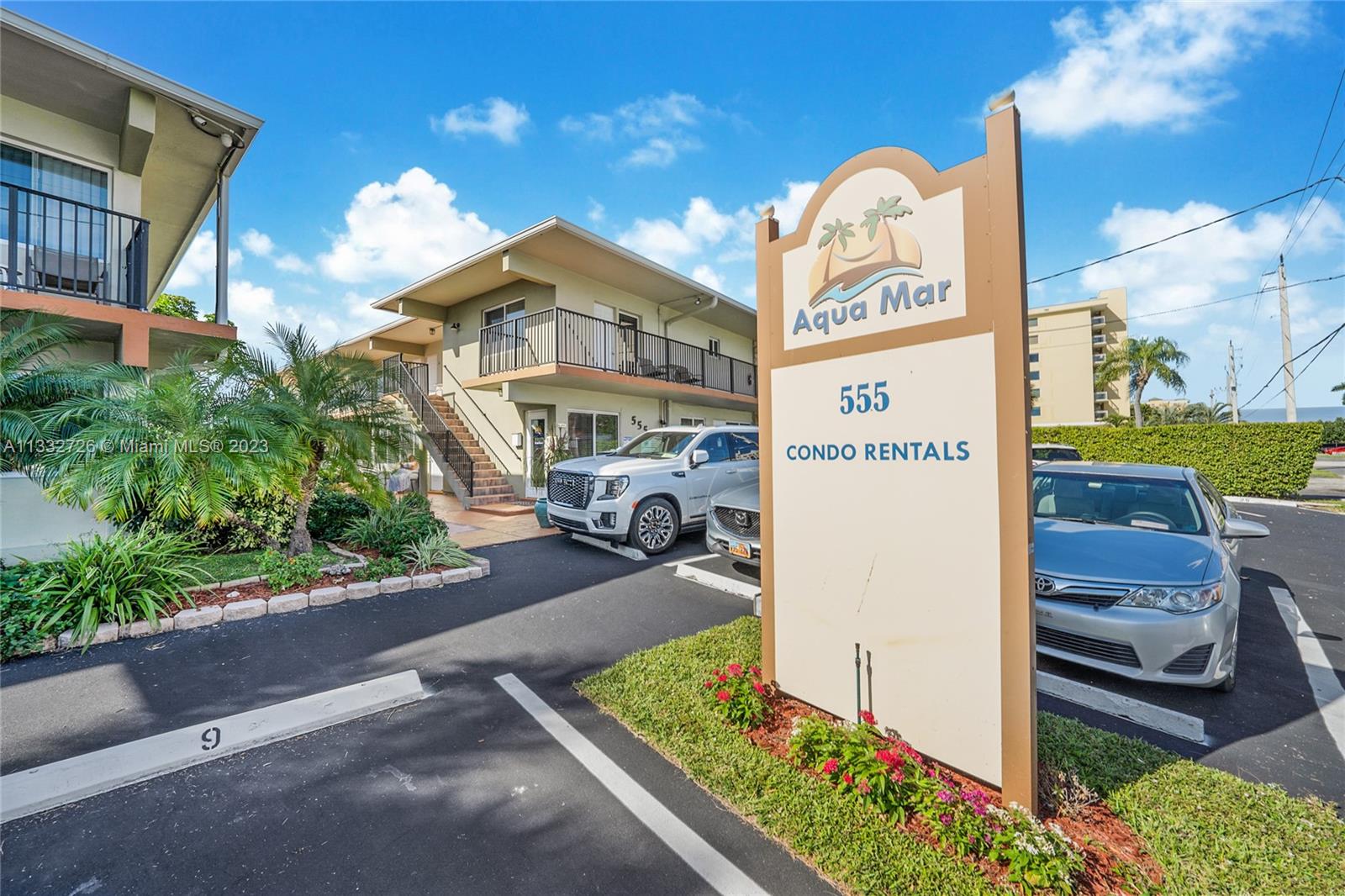 555 North Riverside Drive, Unit 15 Pompano Beach, FL 33062 - Photo 17 of 18 a front view of a building with garden