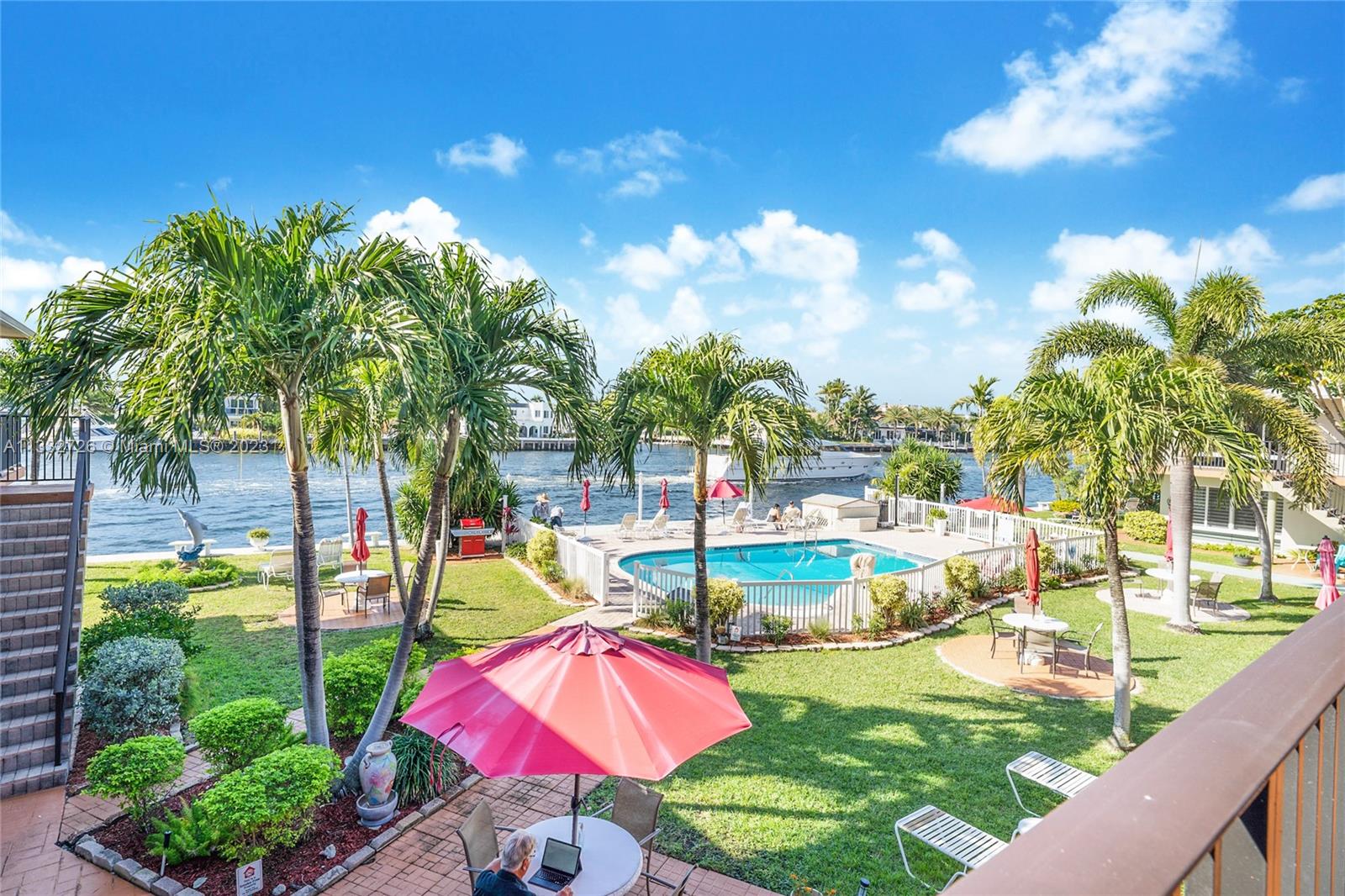 555 North Riverside Drive, Unit 15 Pompano Beach, FL 33062 - Photo 18 of 18 a view of a swimming pool with a patio