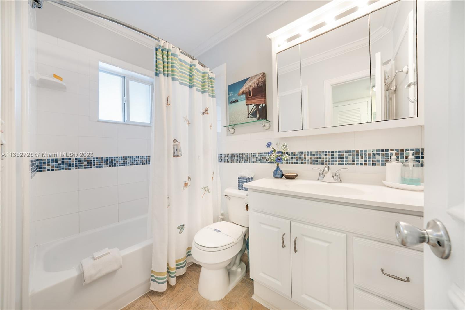 555 North Riverside Drive, Unit 15 Pompano Beach, FL 33062 - Photo 8 of 18 a bathroom with a granite countertop sink a toilet and shower