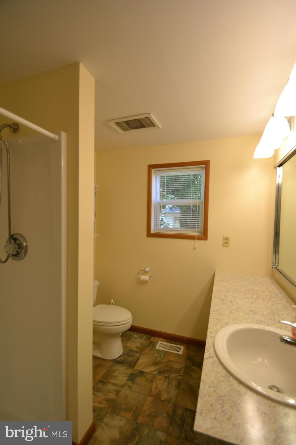 4822 Black Rock Road Hampstead, MD 21074 - Photo 12 of 30 a bathroom with a granite countertop sink and a mirror