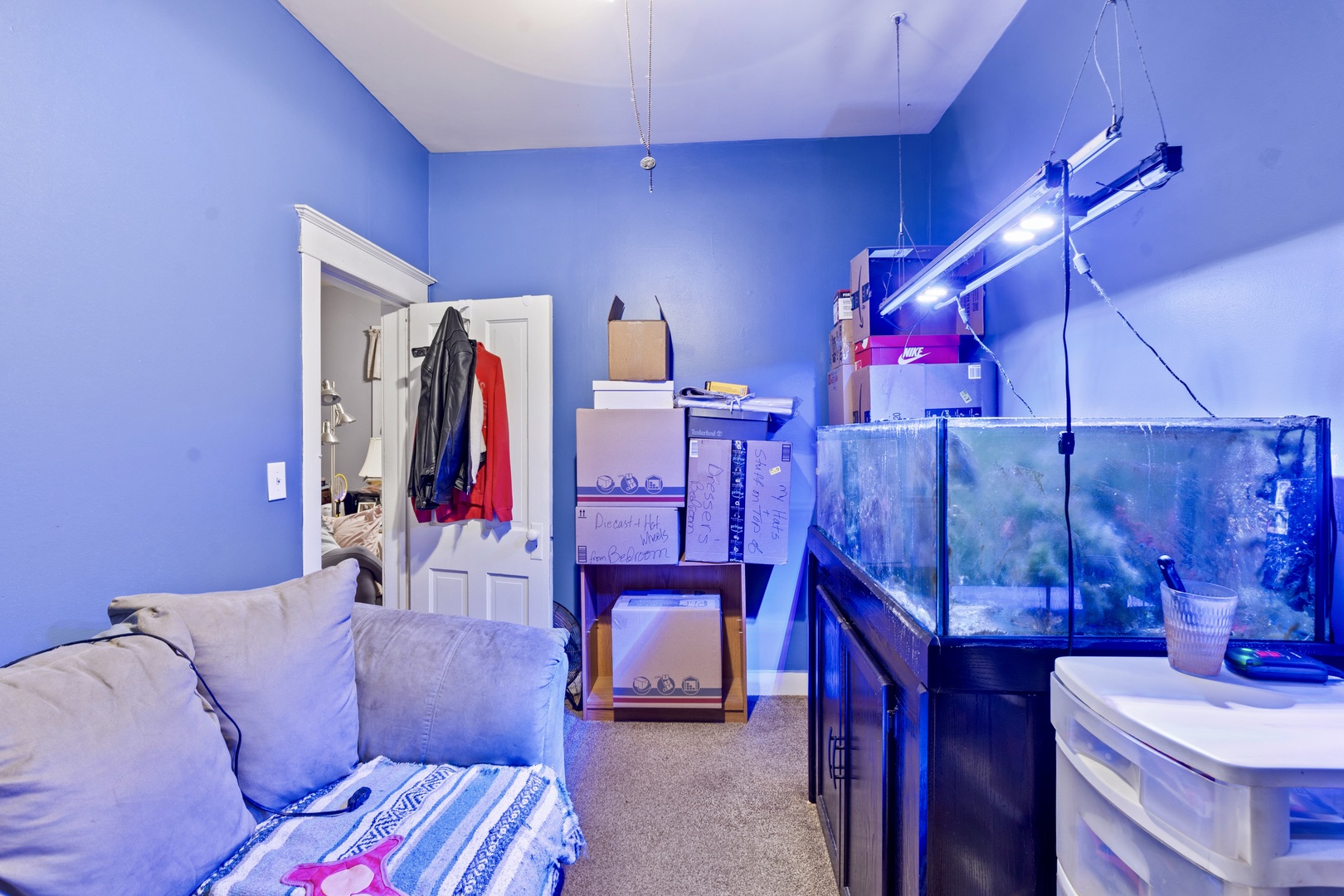 945 West Stone Street Kankakee, IL 60901 - Photo 12 of 28 a living room with furniture and a bed