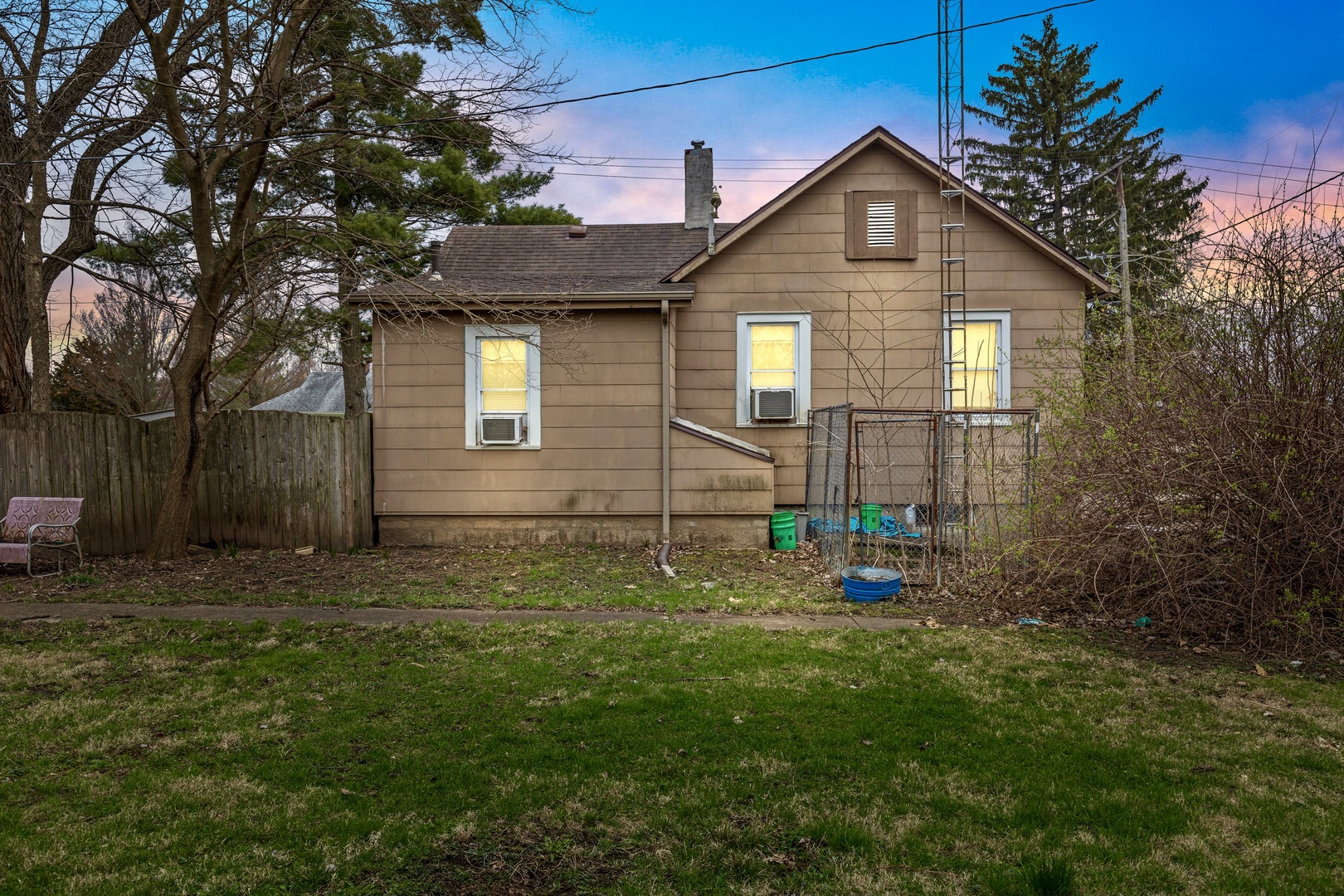 945 West Stone Street Kankakee, IL 60901 - Photo 22 of 28 a front view of a house with a yard