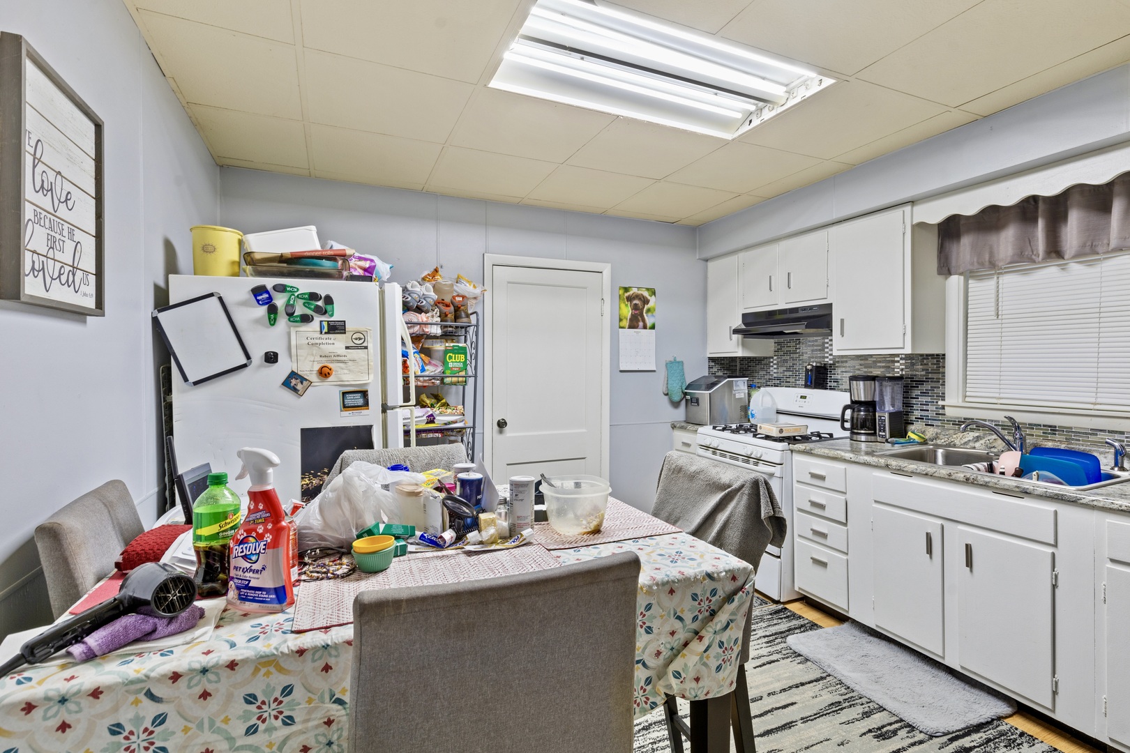 945 West Stone Street Kankakee, IL 60901 - Photo 5 of 28 a view of a kitchen with fridge and workspace