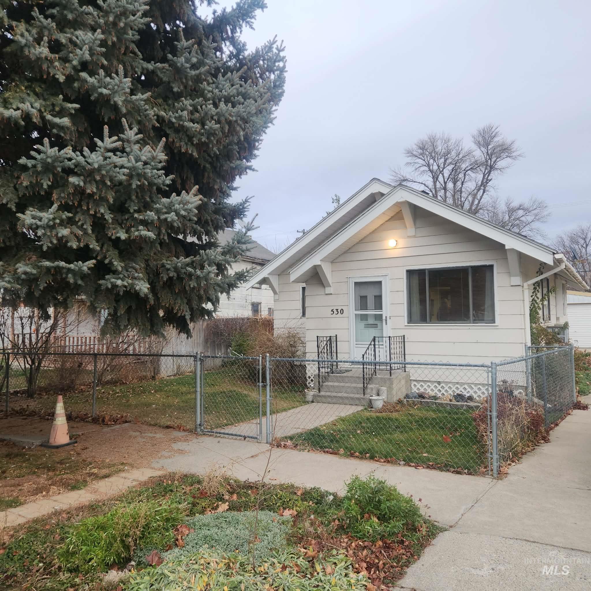 530 California Street Gooding, ID 83330 - Photo 1 of 30 Bungalow-style home featuring a gate and a fenced front yard