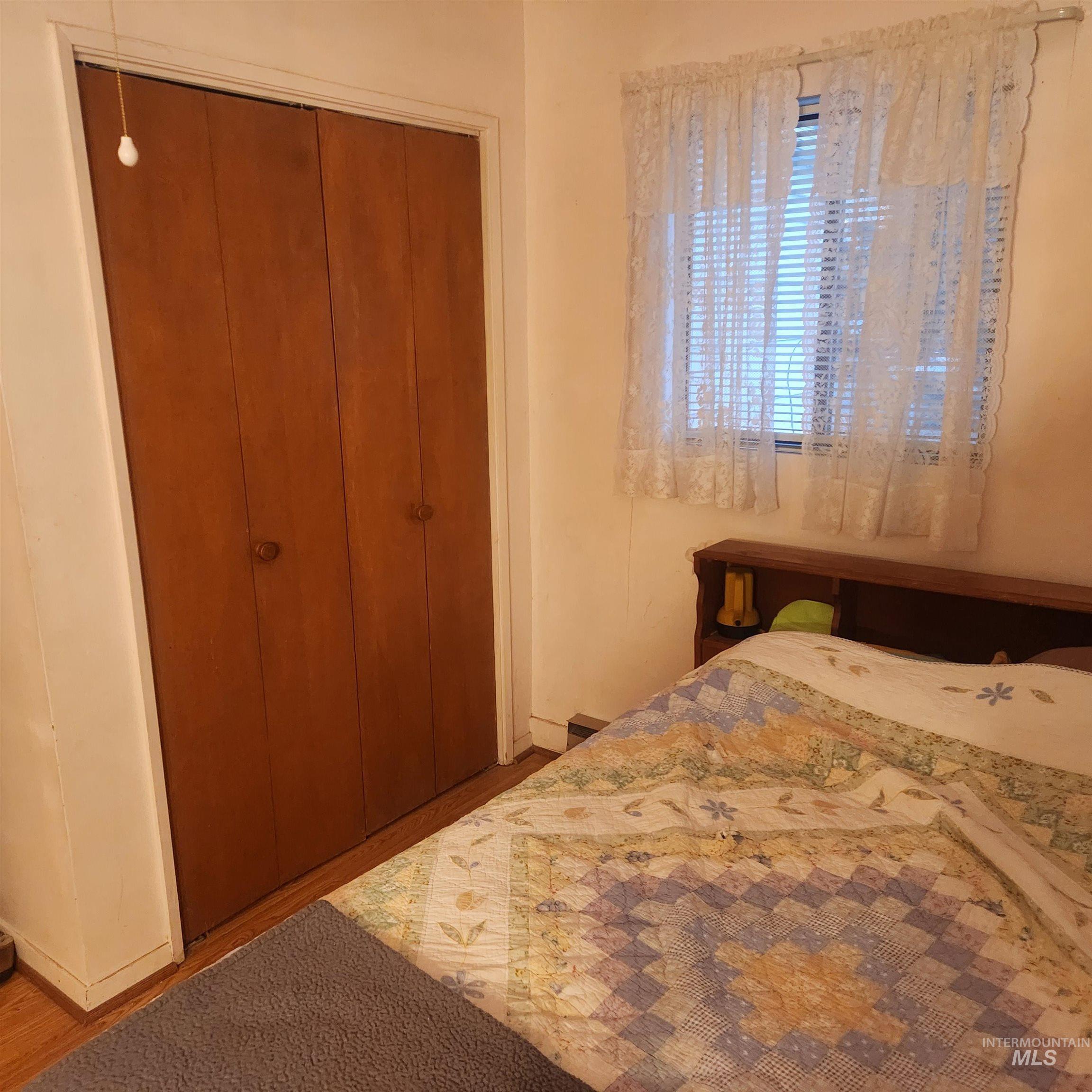 530 California Street Gooding, ID 83330 - Photo 12 of 30 Bedroom featuring wood finished floors and a closet