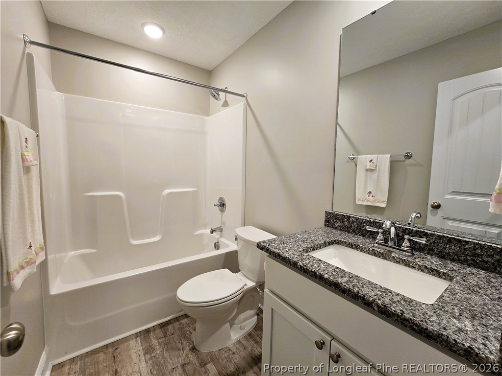 422 Mitchell Farm Road Goldsboro, NC 27530 - Photo 8 of 28 a bathroom with a granite countertop sink toilet and shower