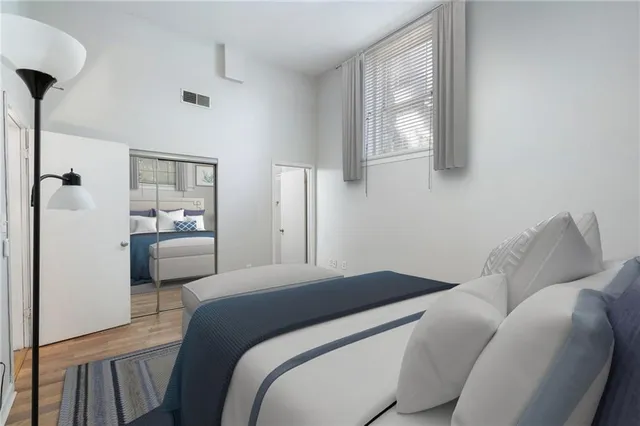 a bedroom with a bed and a view of bathroom