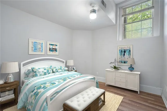 a bedroom with a bed and a window