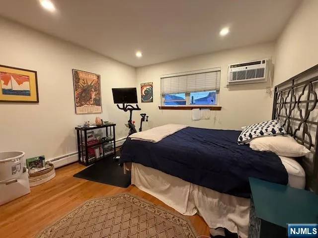 a bedroom with a bed and a chair