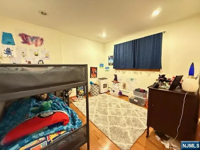 a kitchen with granite countertop lots of clutter and stainless steel appliances