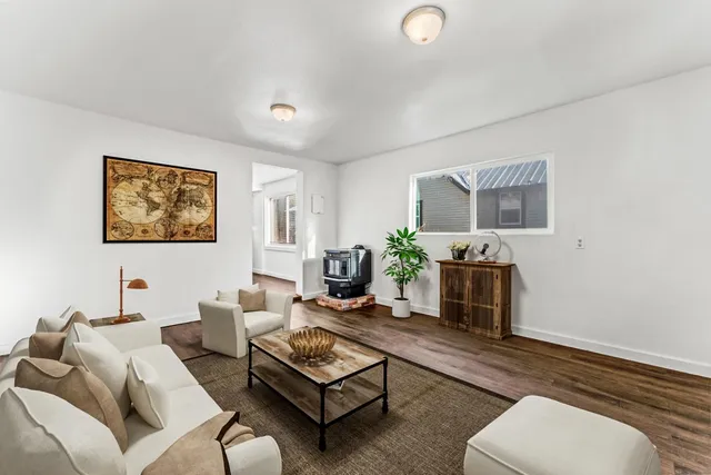 a view of a livingroom with wooden floor