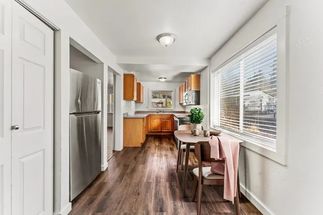 a workspace with furniture window and wooden floor
