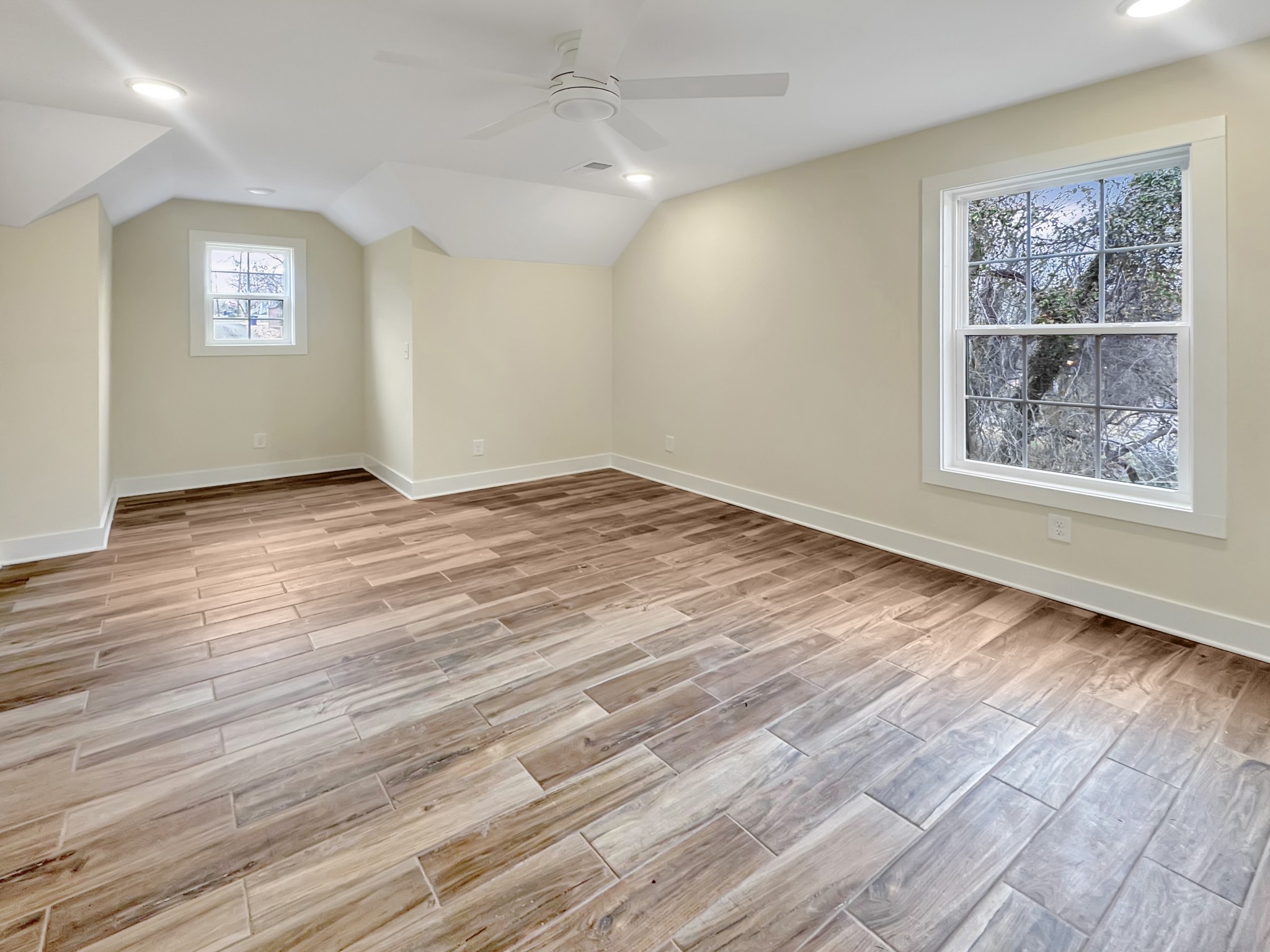 200 Hood Street Dover, TN 37058 - Photo 13 of 27 a view of an empty room with wooden floor and a window