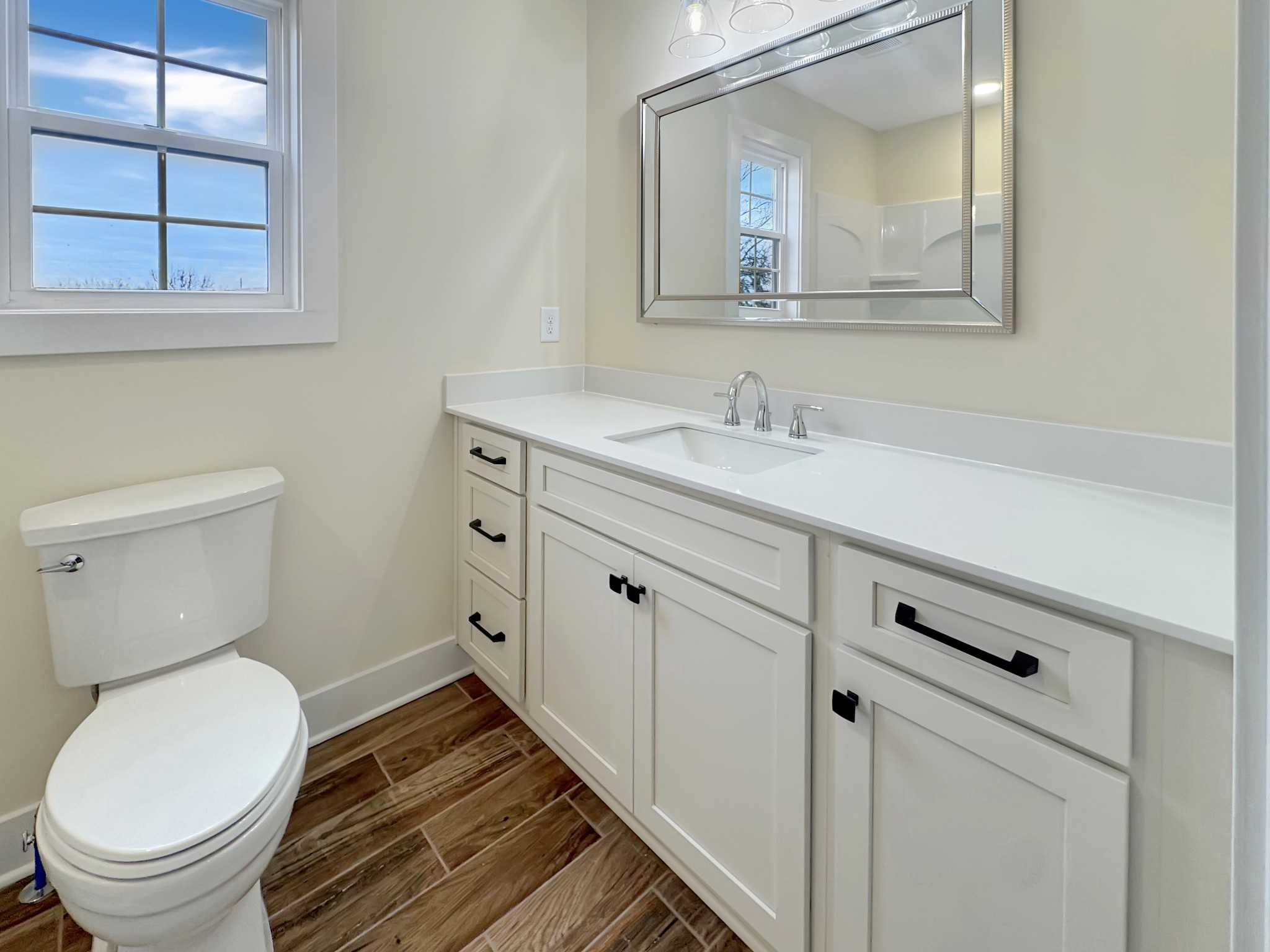200 Hood Street Dover, TN 37058 - Photo 14 of 27 a bathroom with a toilet sink and mirror