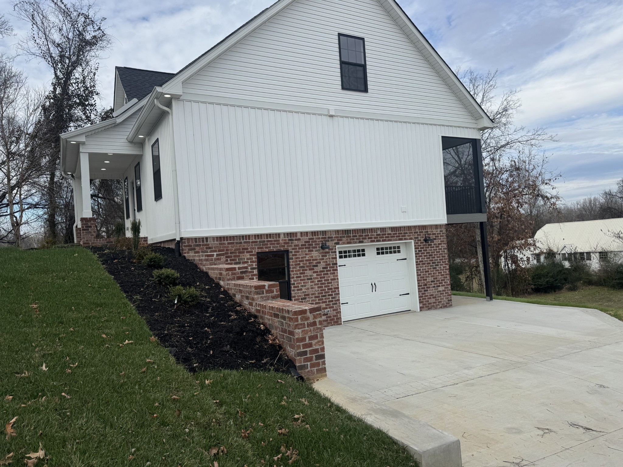200 Hood Street Dover, TN 37058 - Photo 24 of 27 a view of a white house with a yard