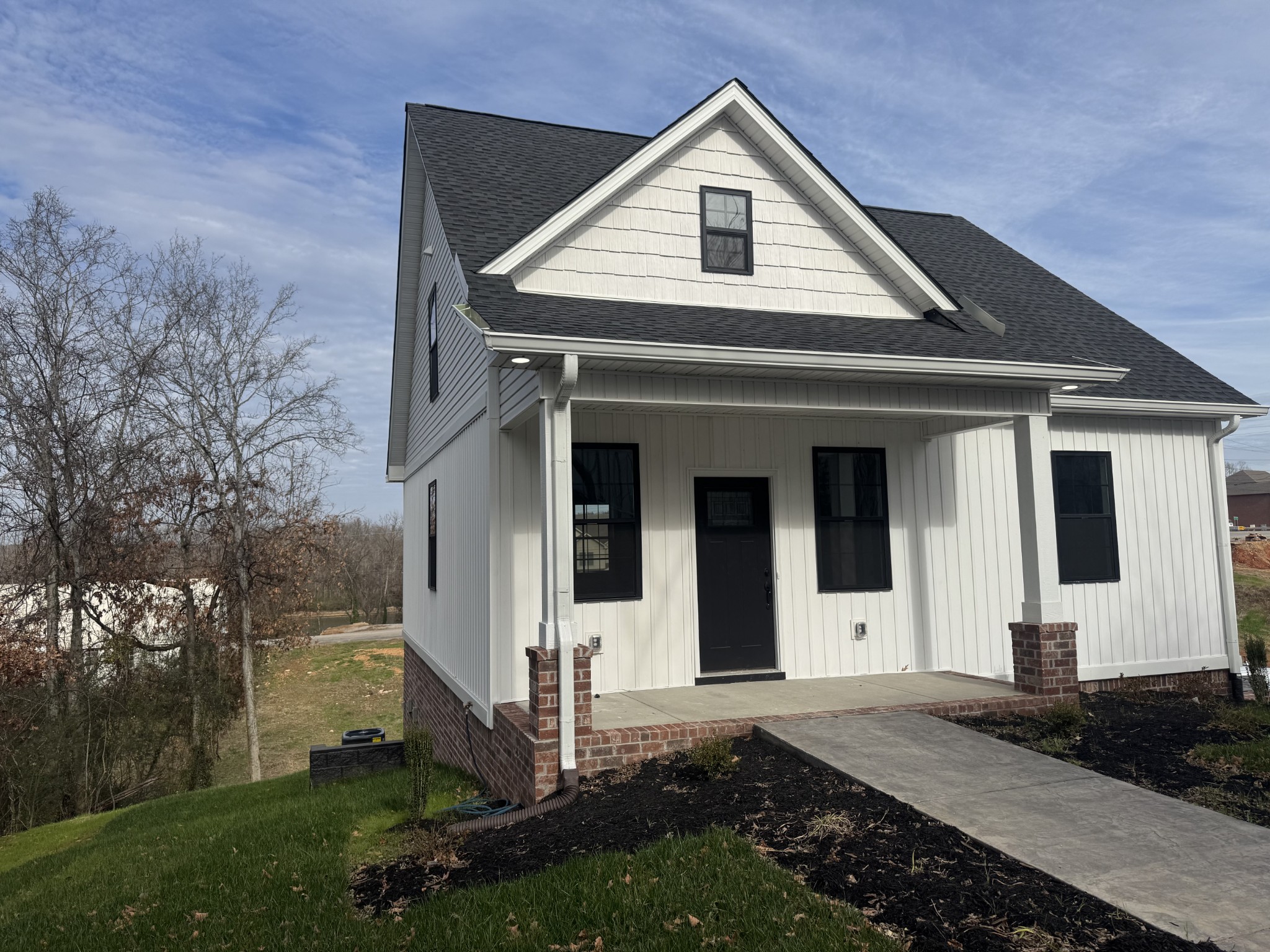 200 Hood Street Dover, TN 37058 - Photo 27 of 27 a front view of a house with a yard