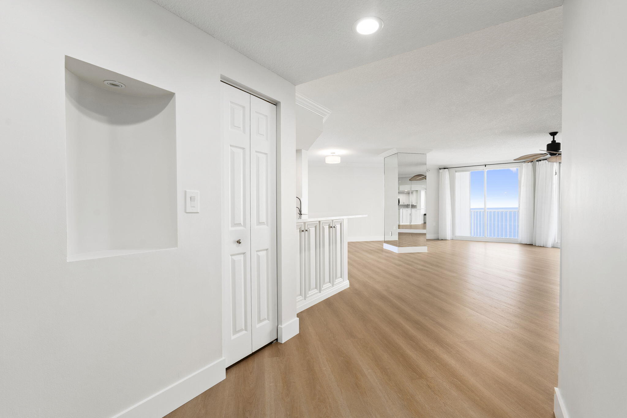 5051 North Hwy A1A, Unit PH24 Fort Pierce, FL 34949 - Photo 33 of 50 a view of a hallway with wooden floor