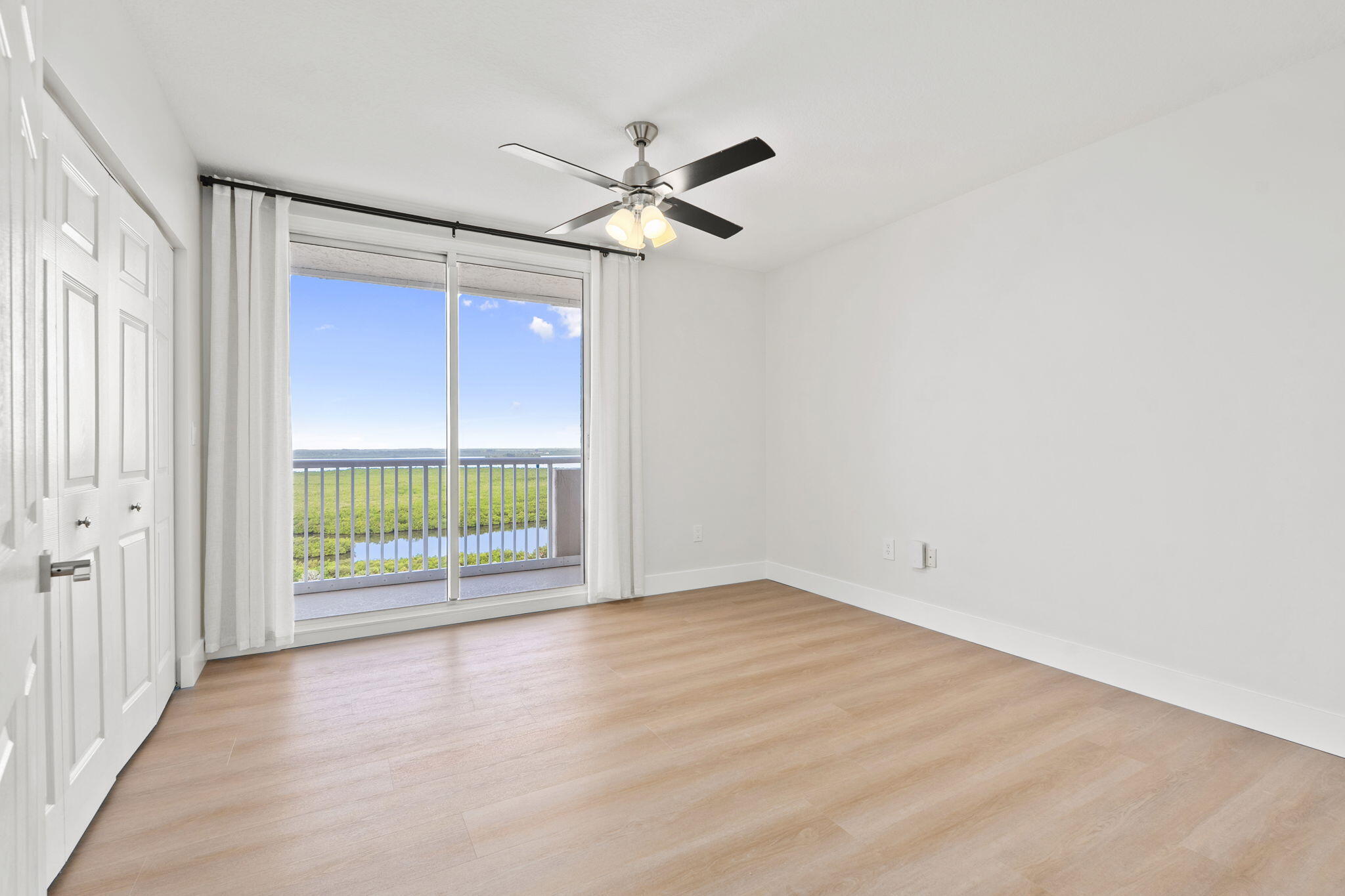 5051 North Hwy A1A, Unit PH24 Fort Pierce, FL 34949 - Photo 38 of 50 an empty room with windows and closet