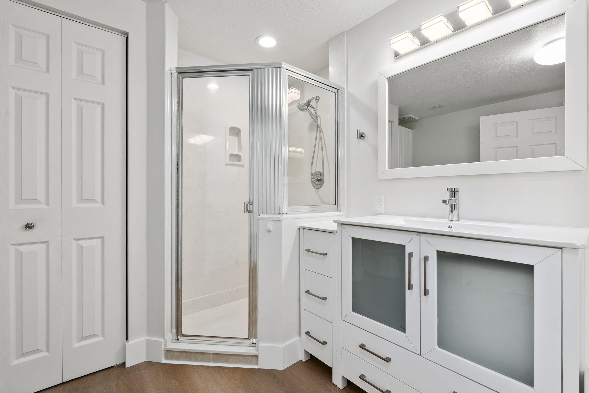 5051 North Hwy A1A, Unit PH24 Fort Pierce, FL 34949 - Photo 41 of 50 a bathroom with a shower sink and mirror