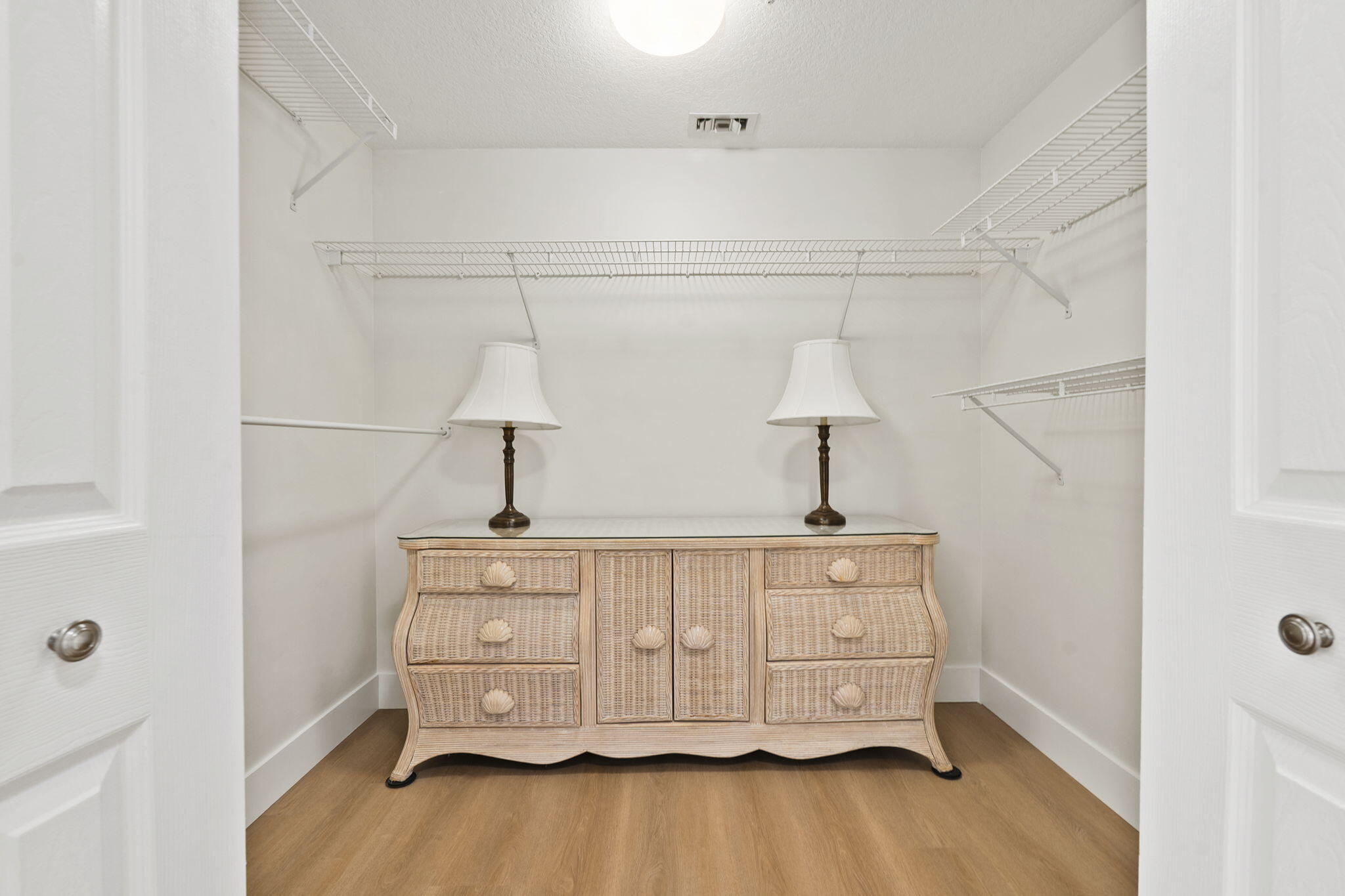 5051 North Hwy A1A, Unit PH24 Fort Pierce, FL 34949 - Photo 42 of 50 a room with a dresser