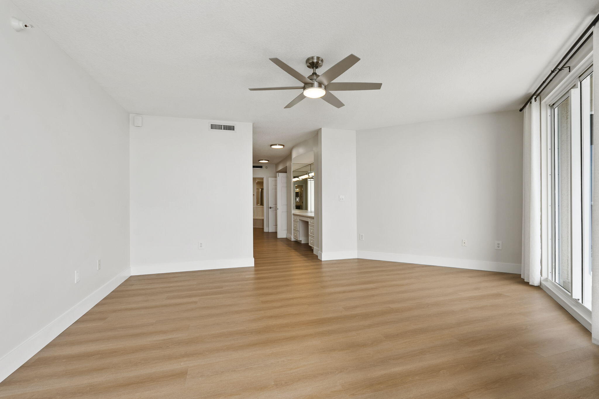 5051 North Hwy A1A, Unit PH24 Fort Pierce, FL 34949 - Photo 43 of 50 a view of an empty room with window and wooden floor