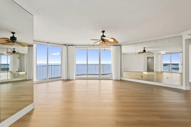 a view of a living room with hardwood floor