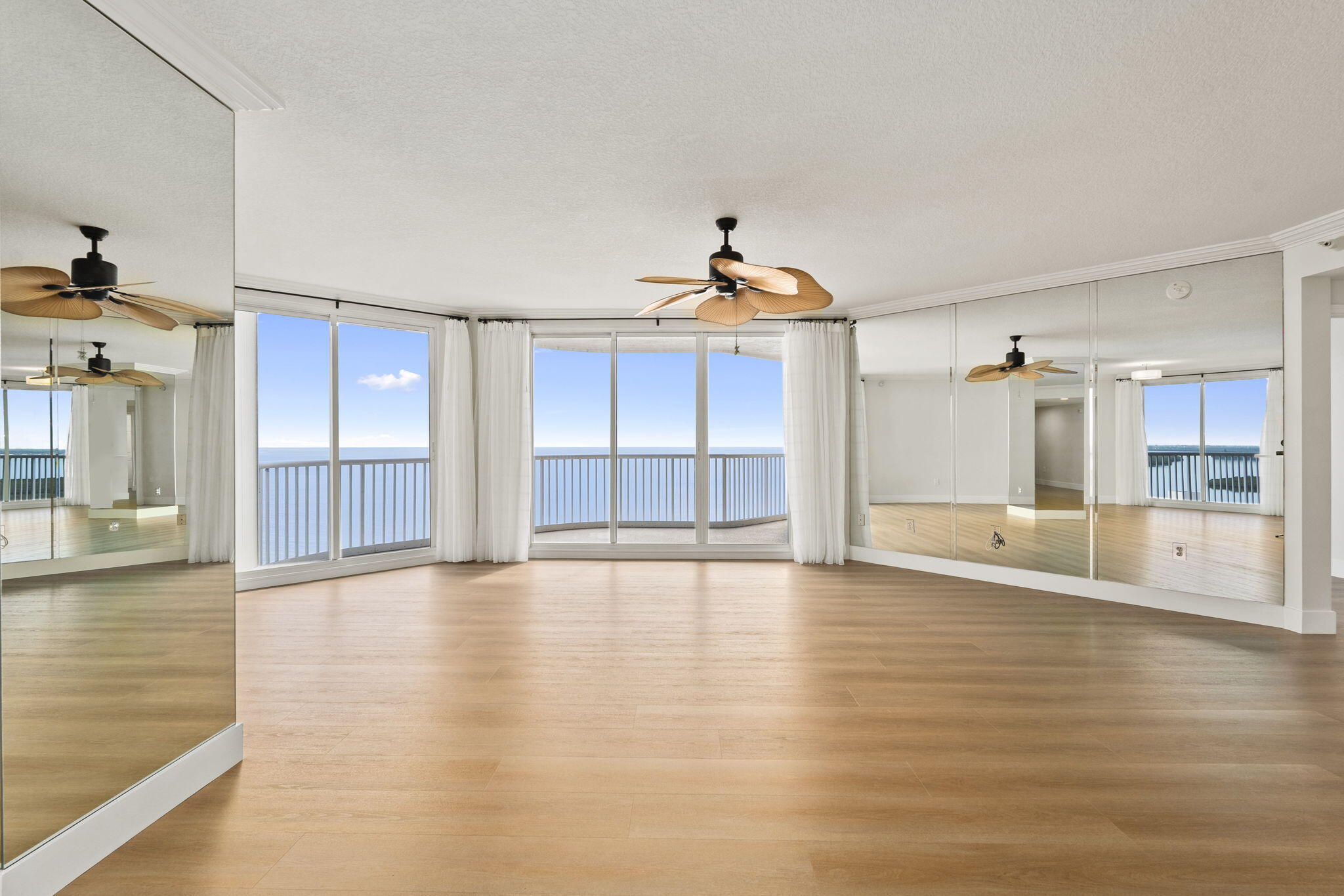 5051 North Hwy A1A, Unit PH24 Fort Pierce, FL 34949 - Photo 7 of 50 a view of an empty room with window and wooden floor