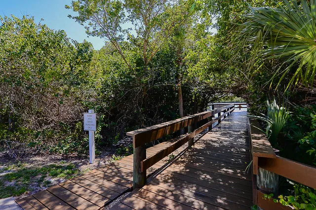 a view of a kitchen with wooden floor and a kitchen