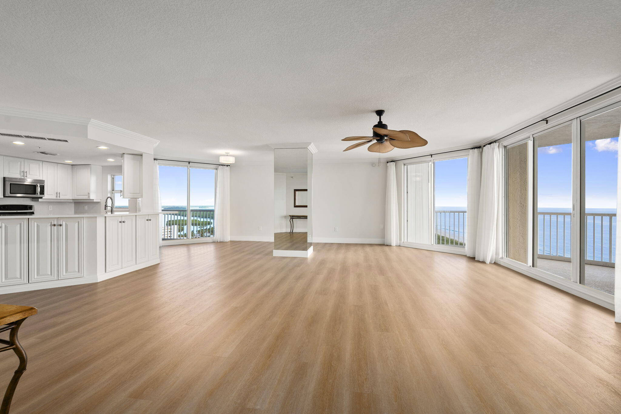 5051 North Hwy A1A, Unit PH24 Fort Pierce, FL 34949 - Photo 10 of 50 a view of a kitchen with wooden floor and a kitchen