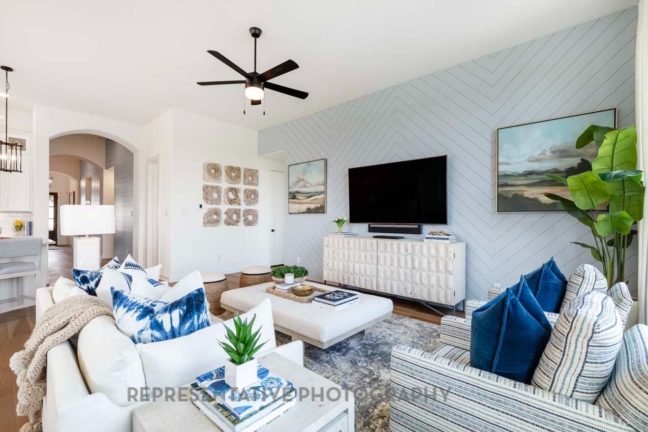 22218 Mount Whitney Road Waller, TX 77484 - Photo 19 of 49 a living room with furniture and a flat screen tv