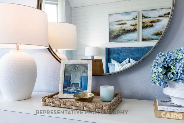 a living room with furniture and flowers