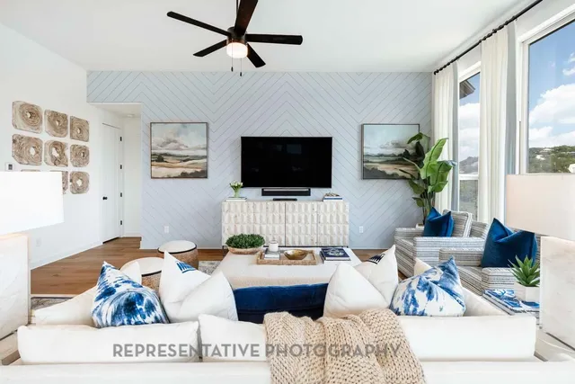 a living room with furniture and a flat screen tv