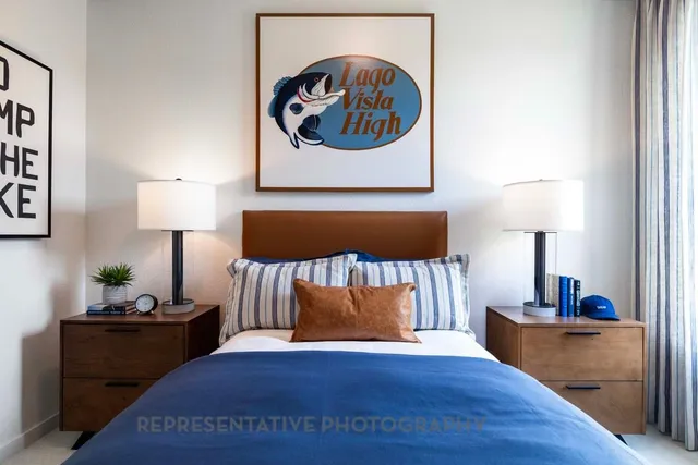 a living room with furniture and painting on the wall