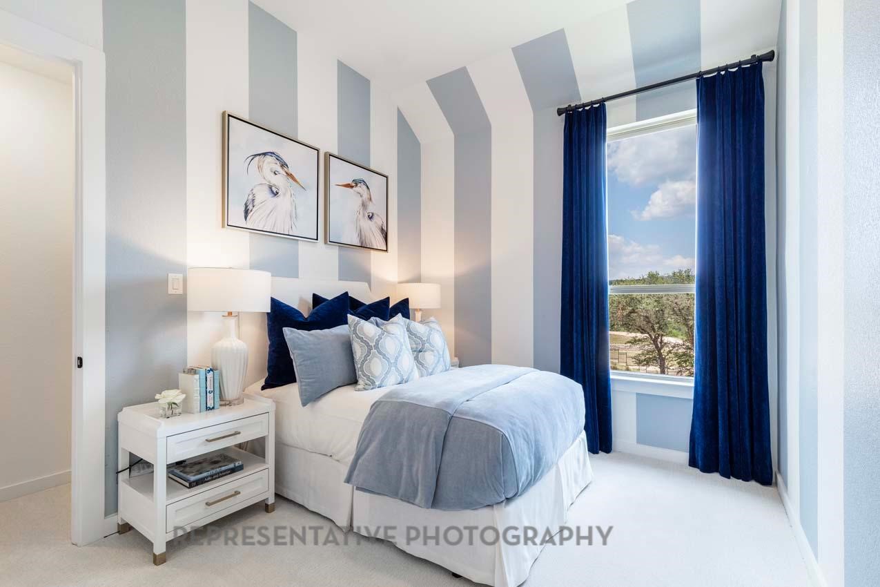 22218 Mount Whitney Road Waller, TX 77484 - Photo 46 of 49 a bedroom with a bed and a painting on the wall