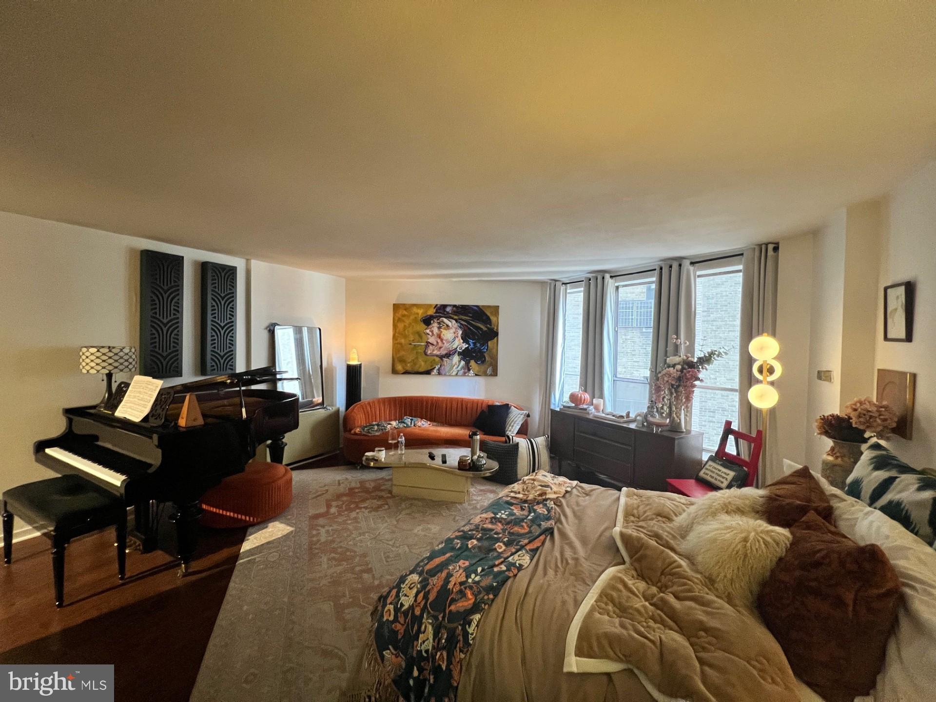 224 West Rittenhouse Square, Unit 1202 Philadelphia, PA 19103 - Photo 11 of 17 a bedroom with a bed and a couch