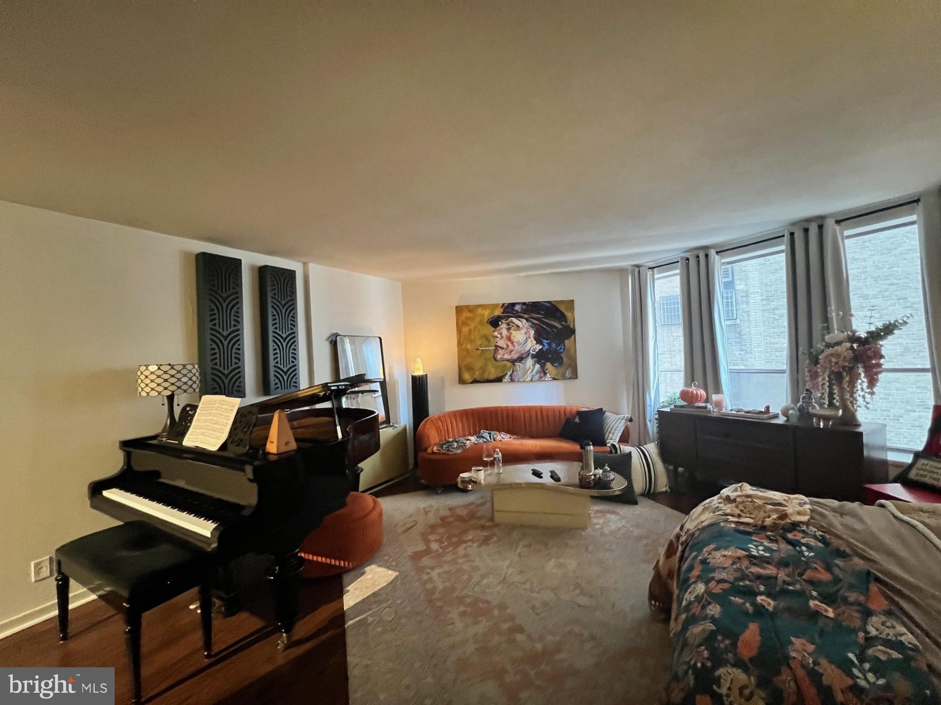 224 West Rittenhouse Square, Unit 1202 Philadelphia, PA 19103 - Photo 12 of 17 a bedroom with furniture and a window