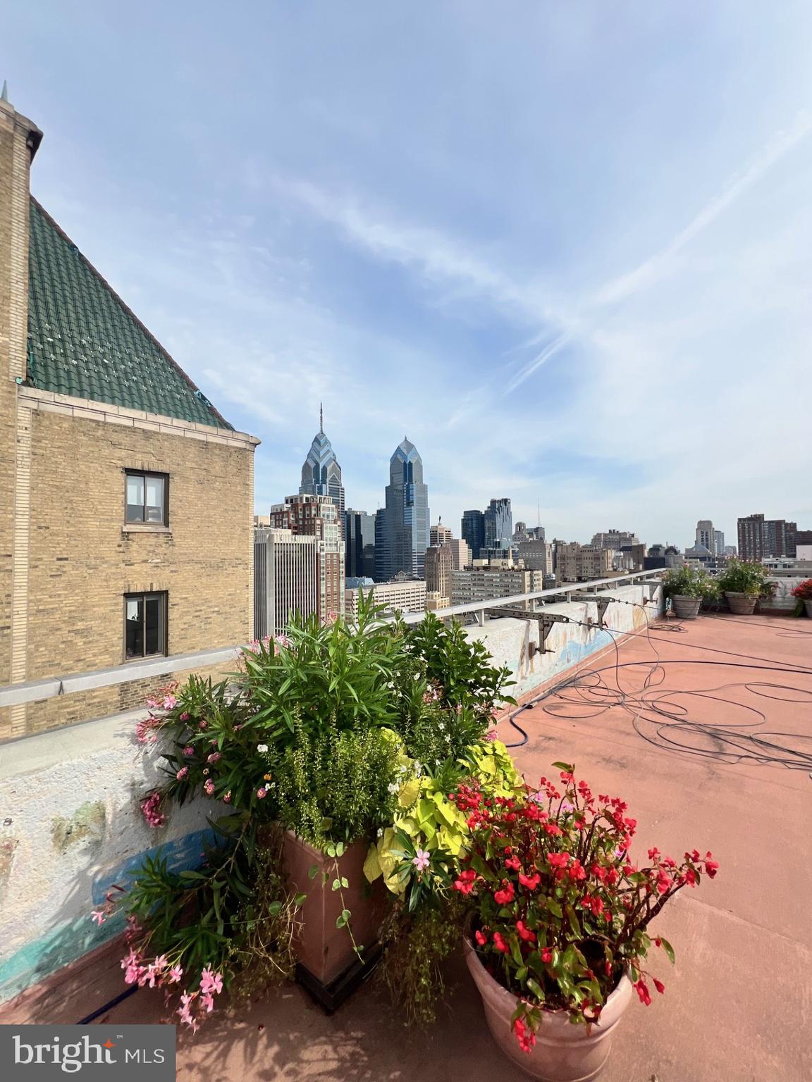 224 West Rittenhouse Square, Unit 1202 Philadelphia, PA 19103 - Photo 13 of 17 a view of a street with flower plants