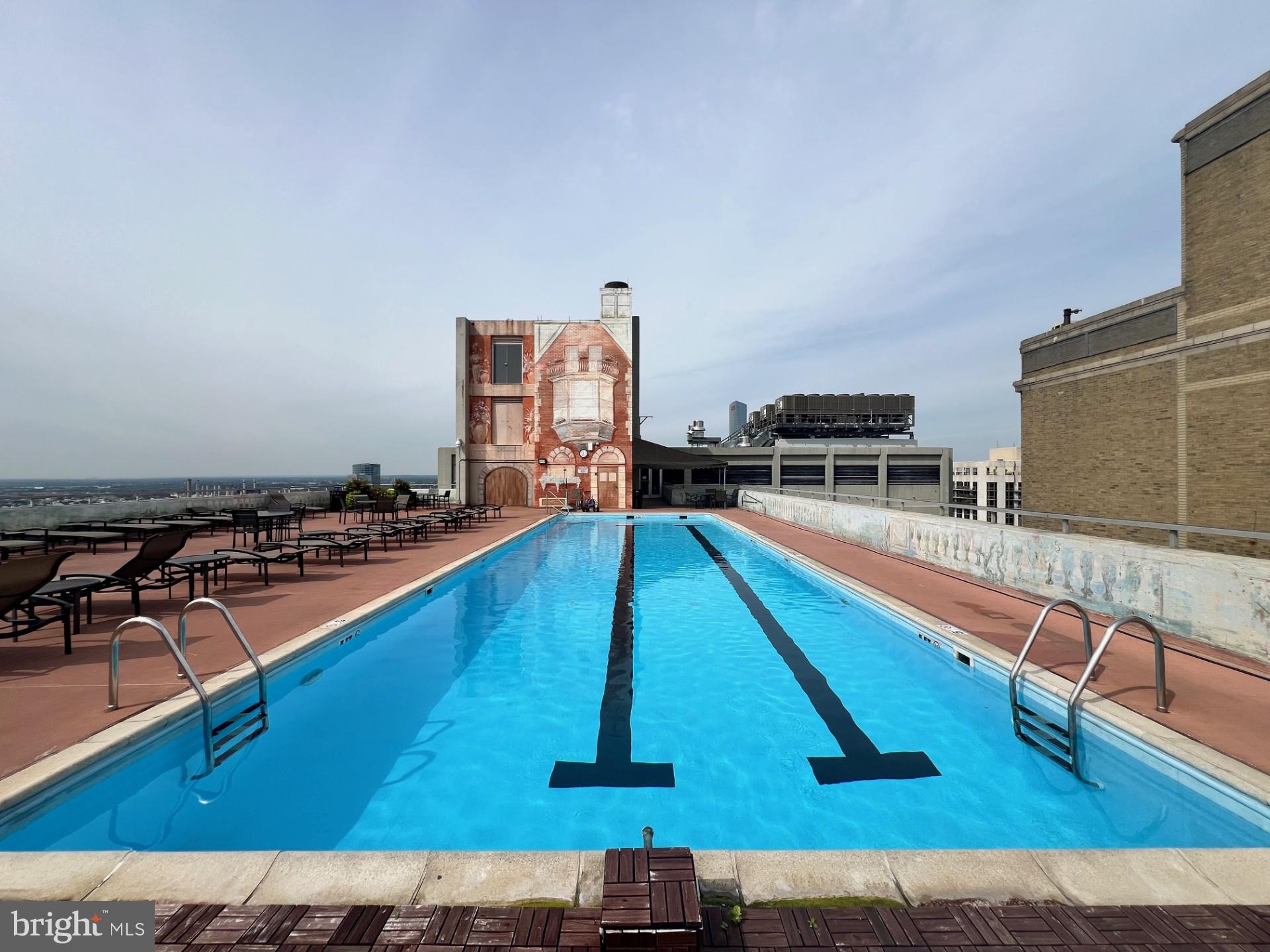 224 West Rittenhouse Square, Unit 1202 Philadelphia, PA 19103 - Photo 14 of 17 a kitchen with wooden floors and a sink